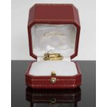 CARTIER PARIS, an eighteen carat yellow gold Russian wedding ring, set with diamonds,