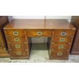 CAMPAIGN DESK, late 19th century mahogany and brass bound of nine drawers in one piece,