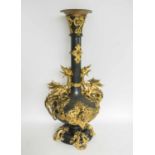 A STRIKING STEEL AND ORMOLU VASE, circa 1900, with gilded dragons and masks, 90cm H.