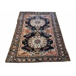 ANTIQUE BAKTIAR RUG, 190cm x 142cm, double rosette medallions within multiple complimentary borders.