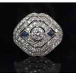 A FINE ART DECO DIAMOND AND CALIBRE SAPPHIRE DRESS RING, mounted in platinum, finger size Q½.