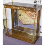 CONSOLE TABLE, Regency rosewood and brass mounted with mirrored back and front column supports,