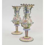 CANTON ENAMEL, 19th century, a pair of lotus shaped famille rose enamel candlesticks (with faults,