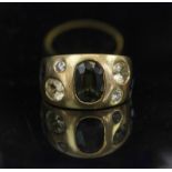 AN EIGHTEEN CARAT GOLD, green tourmaline, sapphire and diamond ring, finger size N½.