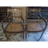 ARMCHAIRS, a pair, Regency style, black lacquer and gilded, each with cane seat, 57cm W.