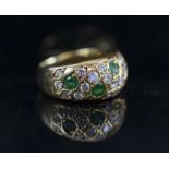 A 1960'S EMERALD AND DIAMOND DRESS RING, mounted in eighteen carat yellow gold,