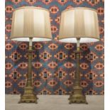 LAMPS, a pair, early 20th century Empire style with tapering columns and platform bases with shades,