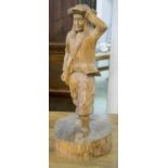 A VINTAGE CARVED WOOD FIGURE, possibly American depicting a scout, 69cm H.