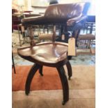 DESK CHAIR, 19th century mahogany, with studded leather bow back and revolving,