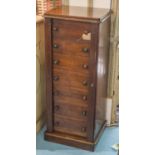 WELLINGTON CHEST, Victorian mahogany with seven graduated drawers and twin hinged stiles,