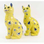 ÉMILLE GALLÉ (Nancy, France), an antique yellow and blue ceramic cat with glass eyes, signed E.