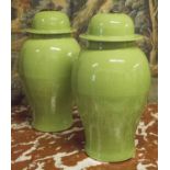 TEMPLE JARS, a pair, Chinese ceramic ginger jar form in leaf green, 53cm H.