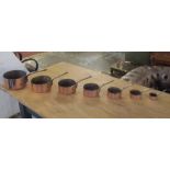 BATTERIE DE CUISINE, a graduated set of seven copper pans, the largest 20cm diam.