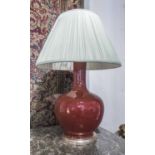 TABLE LAMP, Vaughan style of substantial proportions sang de boeuf, with a pleated shade,