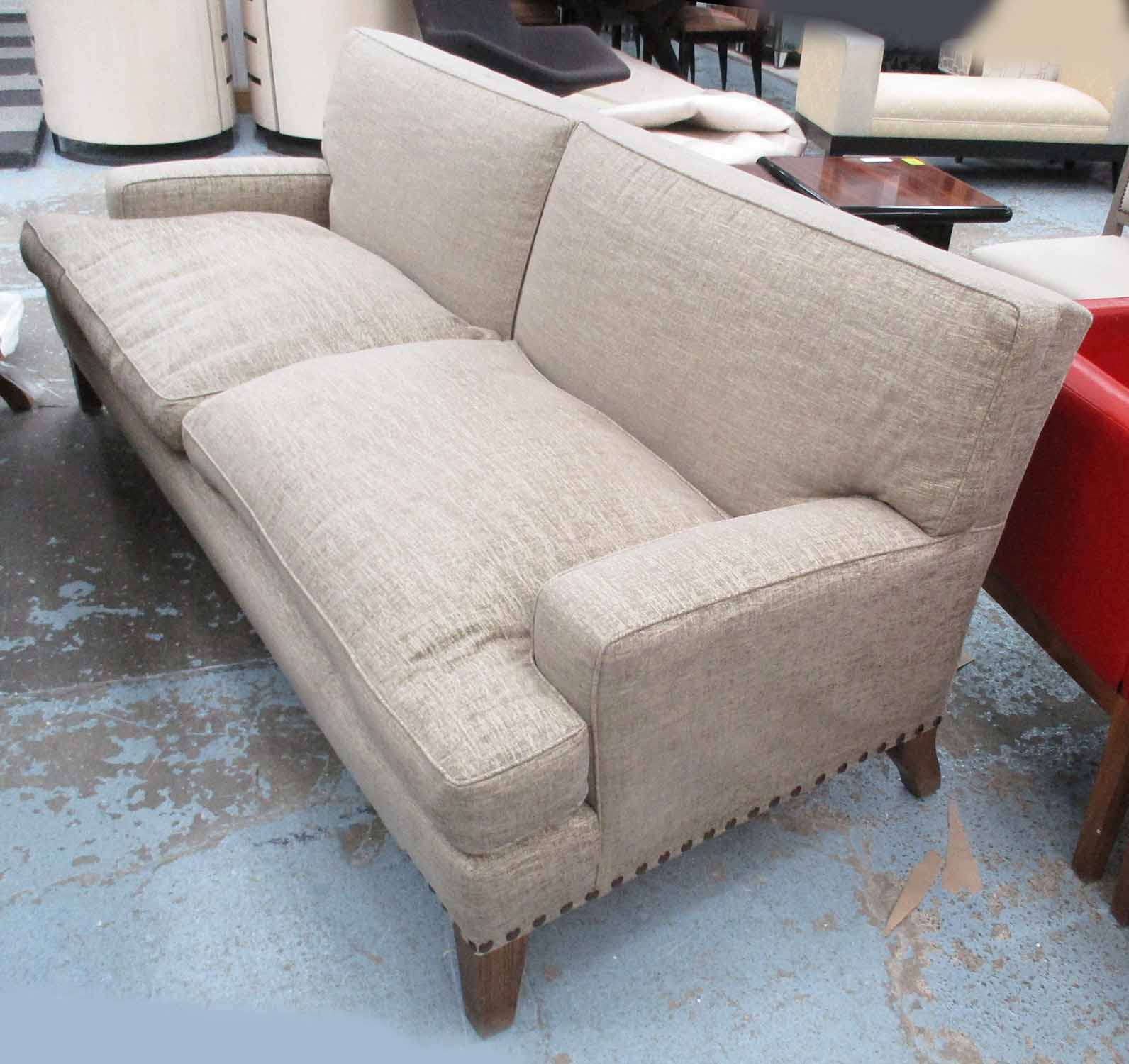 PETER DUDGEON SOFA, large two seater in studded, beige Andrew Martin fabric, on square supports,