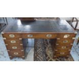 CAMPAIGN STYLE DESK, mahogany and brass bound with nine drawers and tooled black leather top,