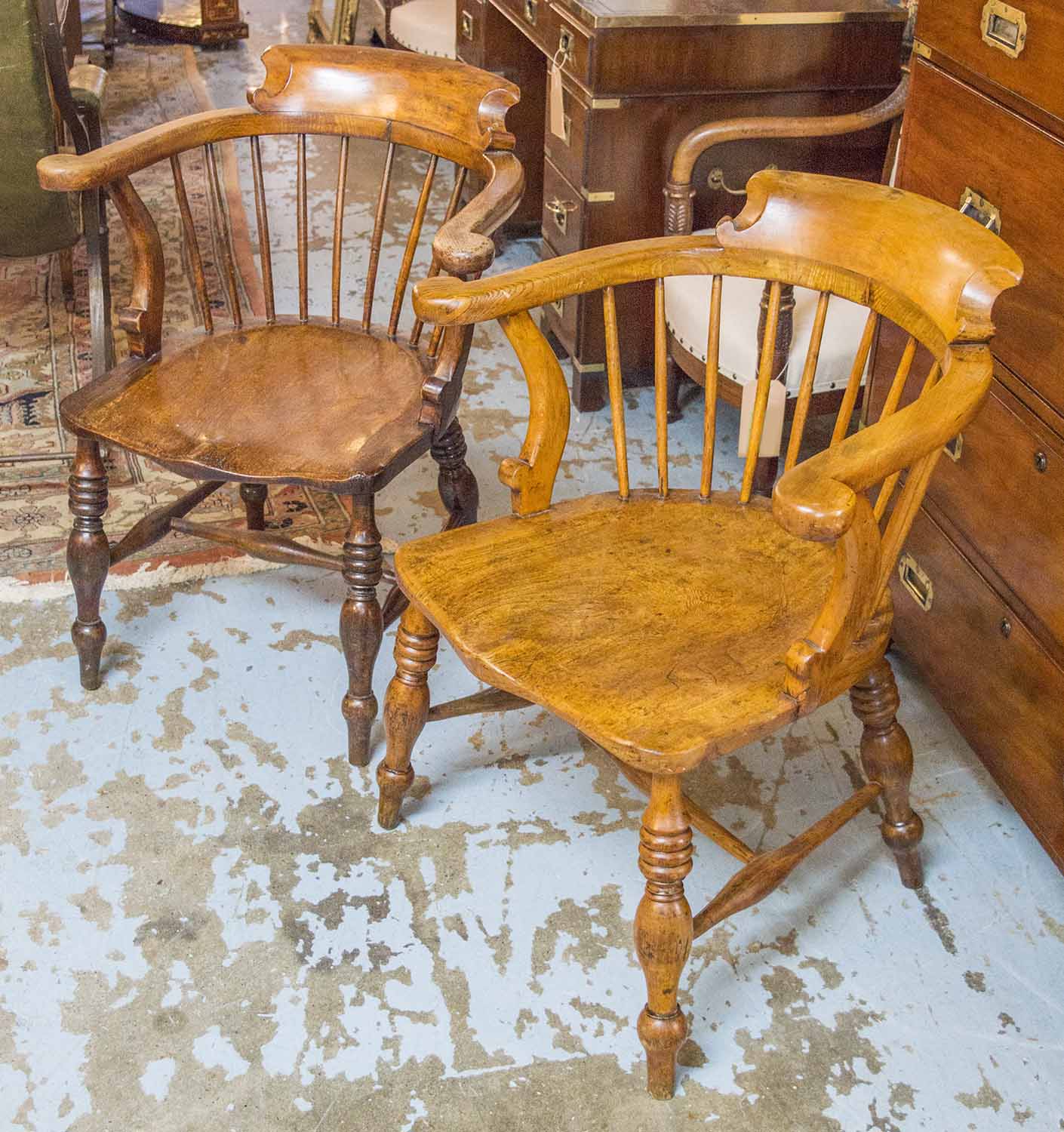 ARMCHAIRS, a pair, 19th century English elm and beech, each with smokers bow back, 65cm W.