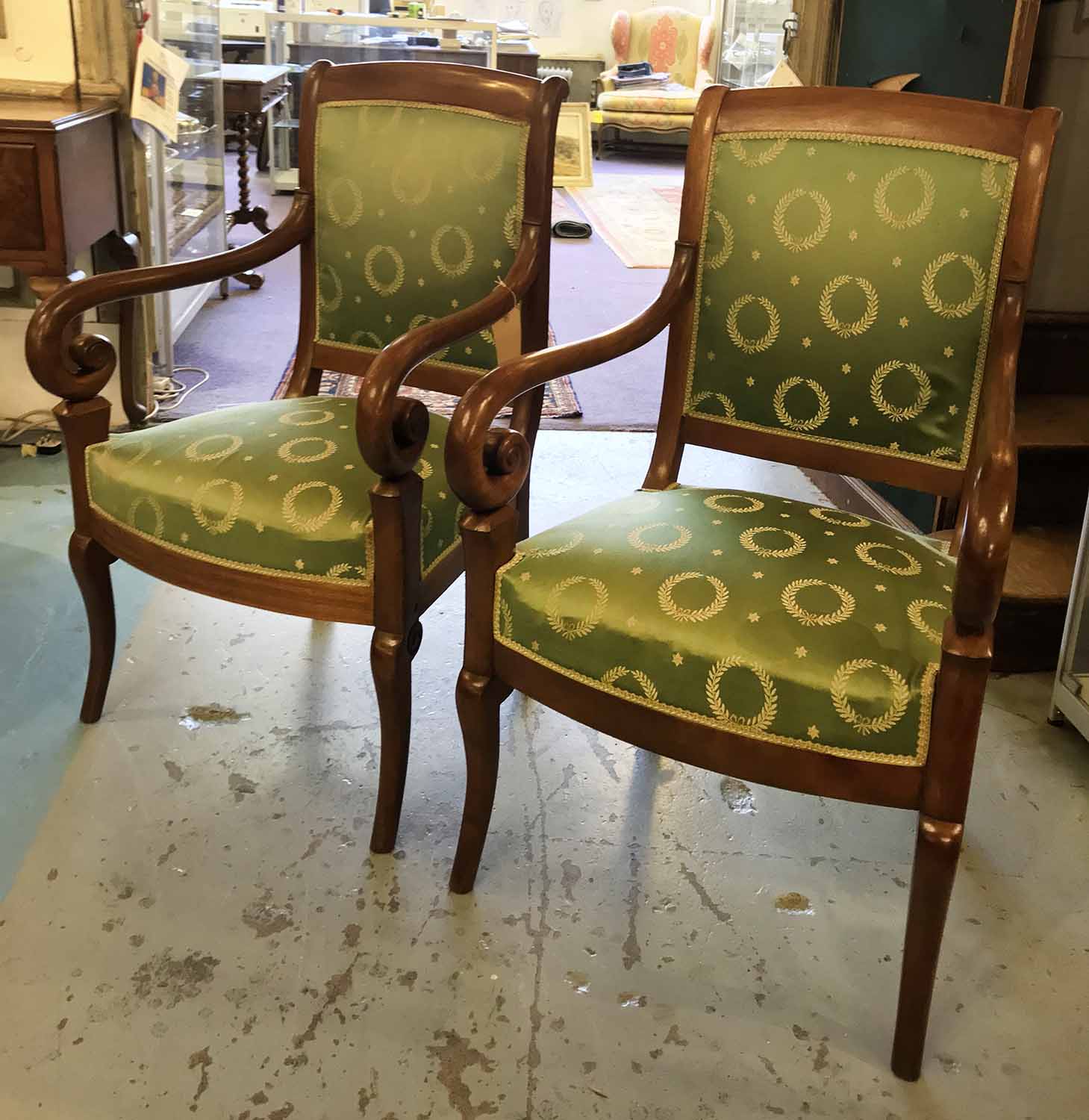 FAUTEUILS, a pair, early 19th century French Charles X mahogany with Empire green silk upholstery.