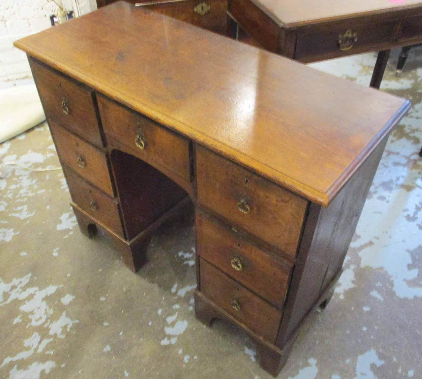 KNEEHOLE DESK, George III oak with seven short drawers below, 96cm W x 79cm H x 39cm D. - Image 2 of 2