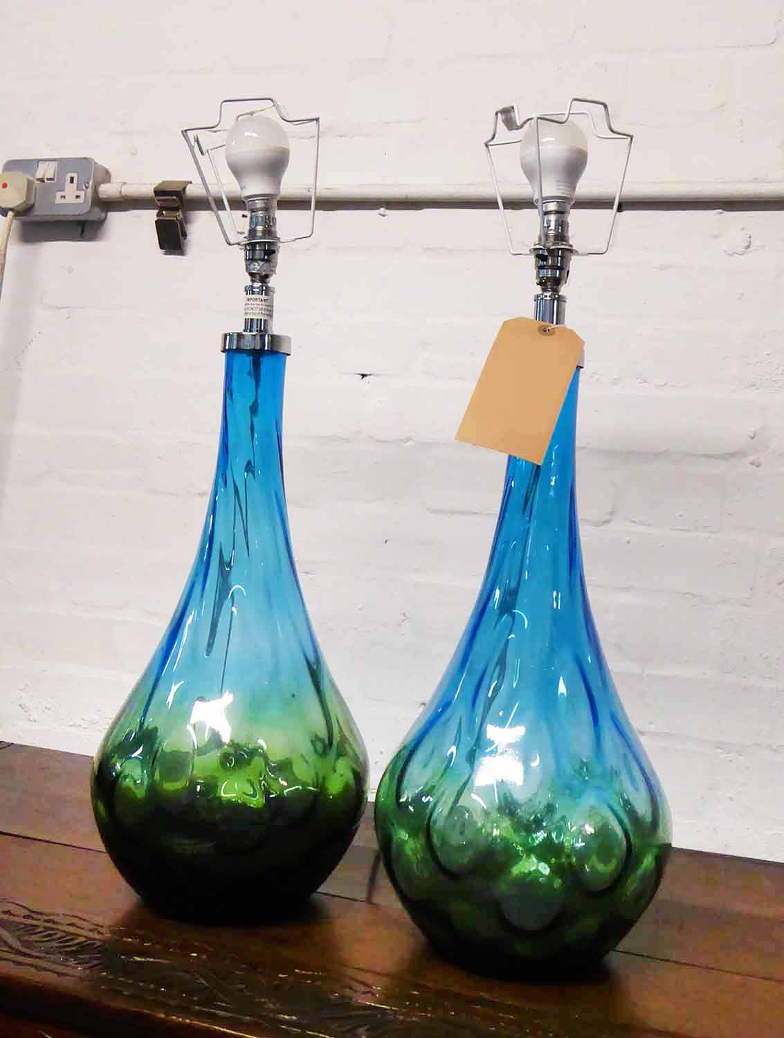 TABLE LAMPS, a pair, blue glass of bulbous form, 67cm H.