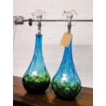 TABLE LAMPS, a pair, blue glass of bulbous form, 67cm H.