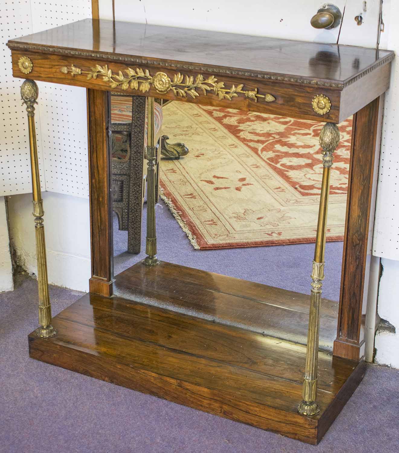 CONSOLE TABLE, Regency rosewood and brass mounted with mirrored back and front column supports,