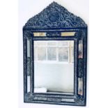 WALL MIRROR, 19th century Dutch repoussé metal and ebony moulded with bevelled rectangular plates,