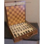 GENTLEMAN'S CHESS SET, leathered finish, 33cm x 36cm x 7cm.