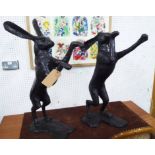 CONTEMPORARY SCHOOL BOXING HARES, a pair, bronze, 85cm H.