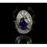A SAPPHIRE AND DIAMOND RING, the pear shaped sapphire centre stone weighing approx 1.