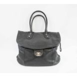 CHANEL TRAVELLING BAG, black leather with silver tone hardware,