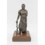 BRONZE AMERICAN CAST FIGURE OF A SAINT, signed and numbered on reverse on a wooden plinth, 29cm H.