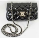 CHANEL MINI FLAP BAG, black patent leather with silver tone hardware,