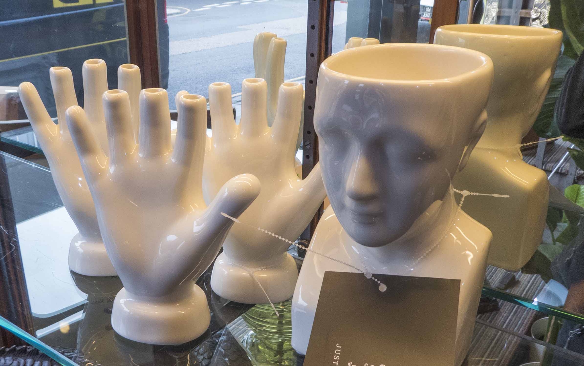 JUSTIN VAN BREDA HAND AND HEAD VASES.