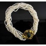AN 18 CARAT YELLOW GOLD DIAMOND AND GEMSET NECKLACE, on ten rows of cultured pearls.