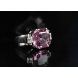 A FINE RED TOURMALINE AND DIAMOND DRESS RING, the square cut cornered Tourmaline, weighing 7.