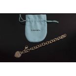 TIFFANY & CO, a silver bracelet with heart shaped pendant attached, 16cm L.