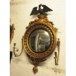 CONVEX GIRANDOLE, Regency painted and gilded with an ebonised eagle surmount, a circular slip,