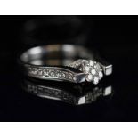 DIAMOND 'DANCING' RING, the 18 carat white gold ring finely set with brilliant cut diamonds,