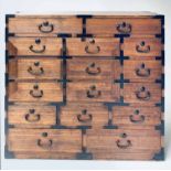 CHEST, 19th century Japanese firwood and elm with twelve drawers and carrying handles,