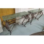 CONSOLE TABLES, a pair, Art Deco style cast metal with green marble tops and carved vine detail,