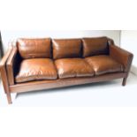 SOFA, 1970's Danish after Borge Mogensen with mid brown leather upholstery and shaped arms, 202cm W.