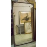WALL MIRROR, late 19th century bronze with rectangular distressed plate, 204cm x 107cm.