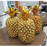 PINEAPPLES, a set of four, stylised oversized form, 50cm H.