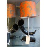 TABLE LAMPS, a pair, with mounted horns on a black base, overall each 71cm H including shades.