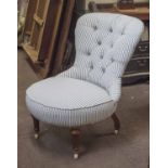 NURSING CHAIR, Victorian upholstered in ticking on fluted legs and castors, 60cm W.