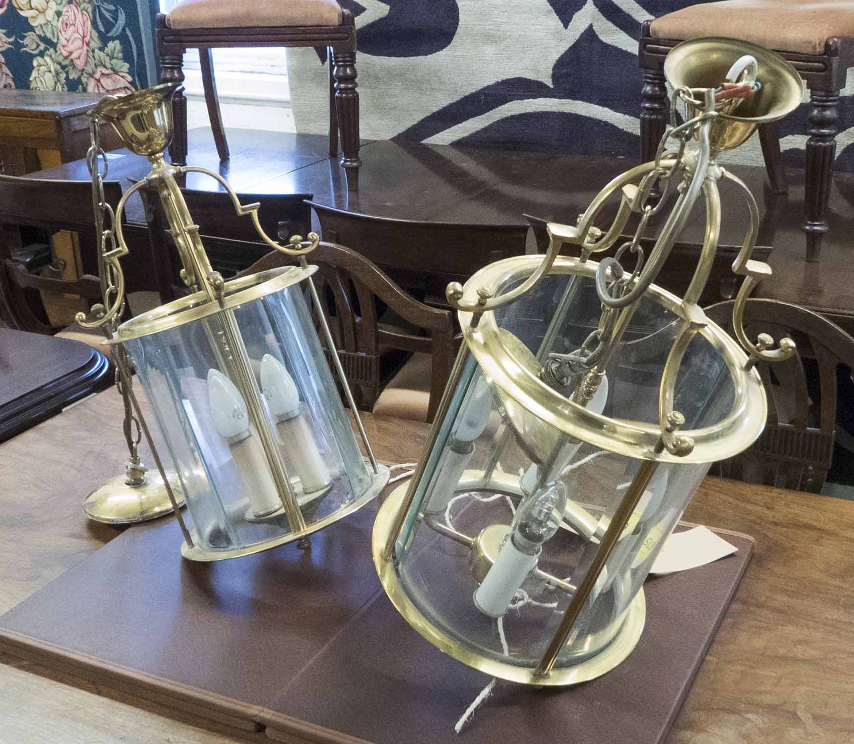 HALL LANTERNS, two, brass of cylindrical form with glass panels, one 61cm H x 32cm,
