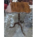 LAMP TABLE, 19th century the shaped mahogany tilt top on a turned column with tripod supports base,