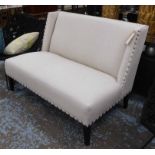 INDIA JANE SOFA, two seater, in beige fabric studded on square supports, 133cm L.