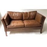 SOFA, 1970's Danish teak framed with mid brown shaped and piped leather cushions,